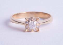 An 18ct nine stone diamond cluster ring, size P.