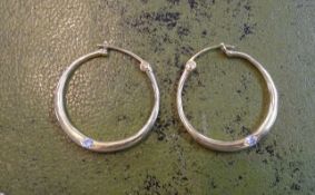 A pair of 18ct diamond set hoop earrings, approx 9g.