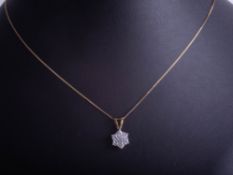 A 9ct diamond pendant necklace, with diamond identification certificate, indicating 0.33ct.