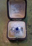 A platinum diamond and sapphire ring set with baguette and round cut diamonds, size U, purchased in