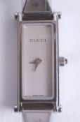 Gucci, a ladies fashion wristwatch with paperwork.