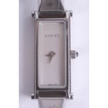 Gucci, a ladies fashion wristwatch with paperwork.