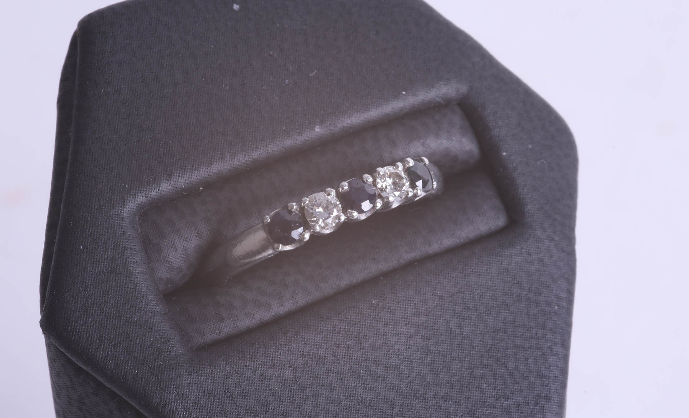 A platinum sapphire and diamond set five stone ring, size N. - Image 2 of 2