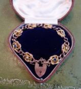 A 9ct antique gold bracelet set with sapphire and pearl with padlock and fitted cased, approx 18g.