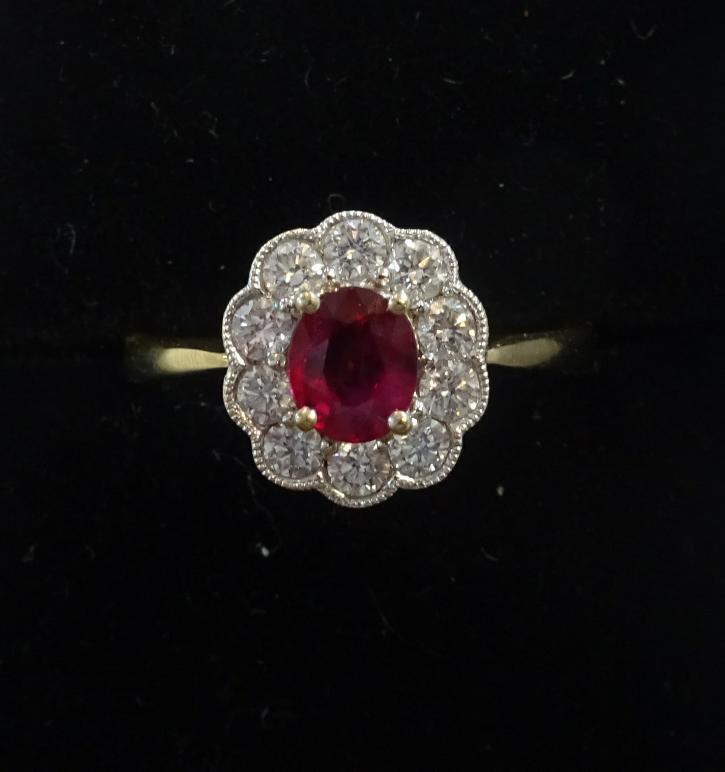 A good 18ct ruby and diamond cluster ring, ring size T.