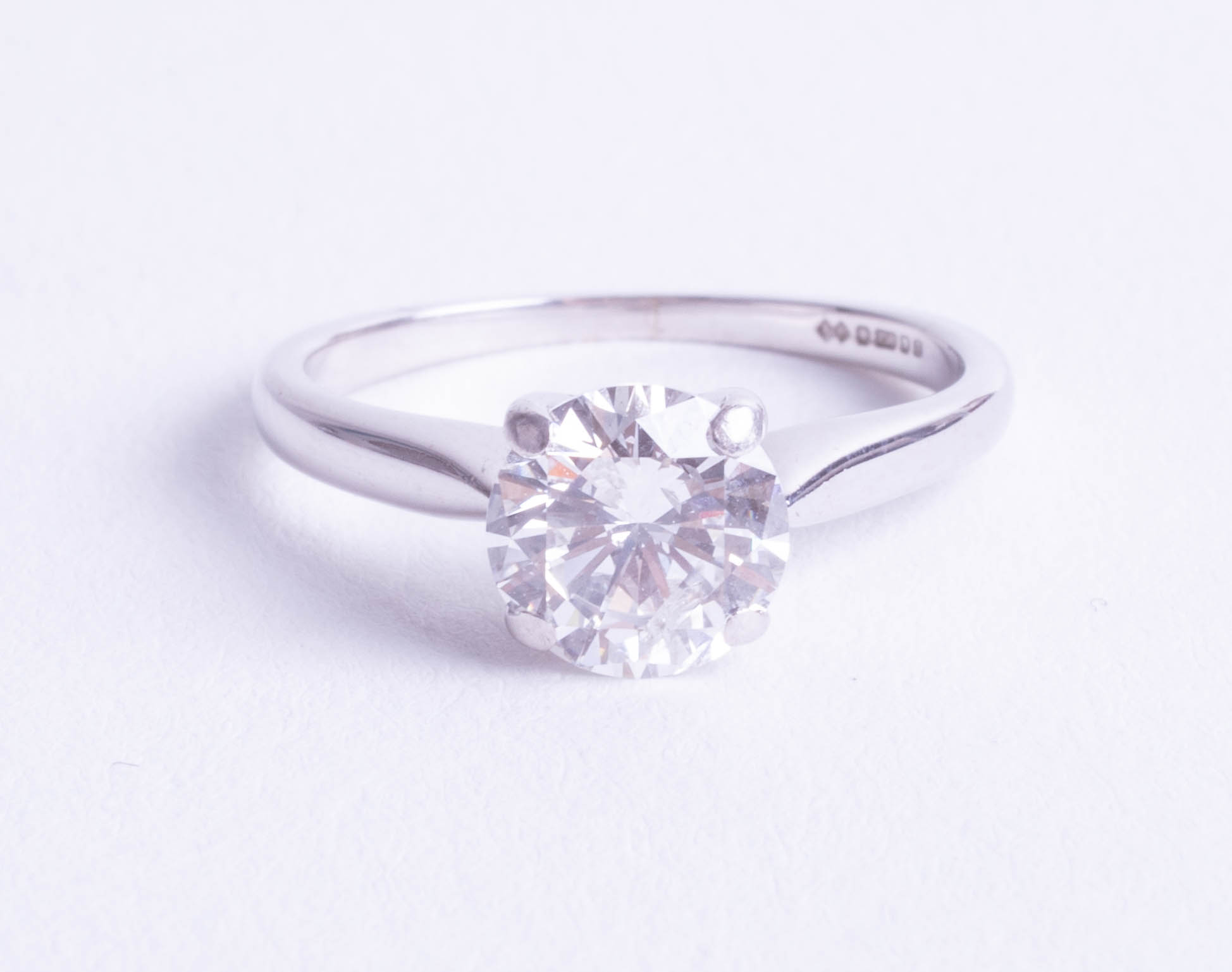 An 18ct white gold diamond round brilliant cut ring, approx 1.23ct, clarity SI 1, colour H, ring
