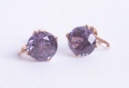 A pair of synthetic Alexandrite earrings set in yellow 18ct gold.