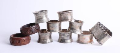 An assortment of napkin rings including 3 silver (2.36oz)