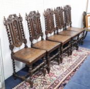 Five Victorian carved oak dining chairs.
