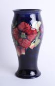 A Moorcroft blue anemone vase, height 25cm stamped and signed.