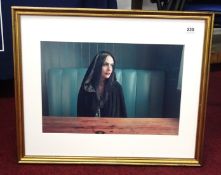 Woman in a black hood, a photographed portrait by Jojo from his 14th exhibition, Table 32 at the