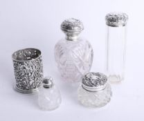 4 various silver top bottles and scent together with a silver ornate bottle holder (5).