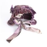 A Victorian velvet bonnet reputedly to have been owned by the Royal Family. In the middle1800s a