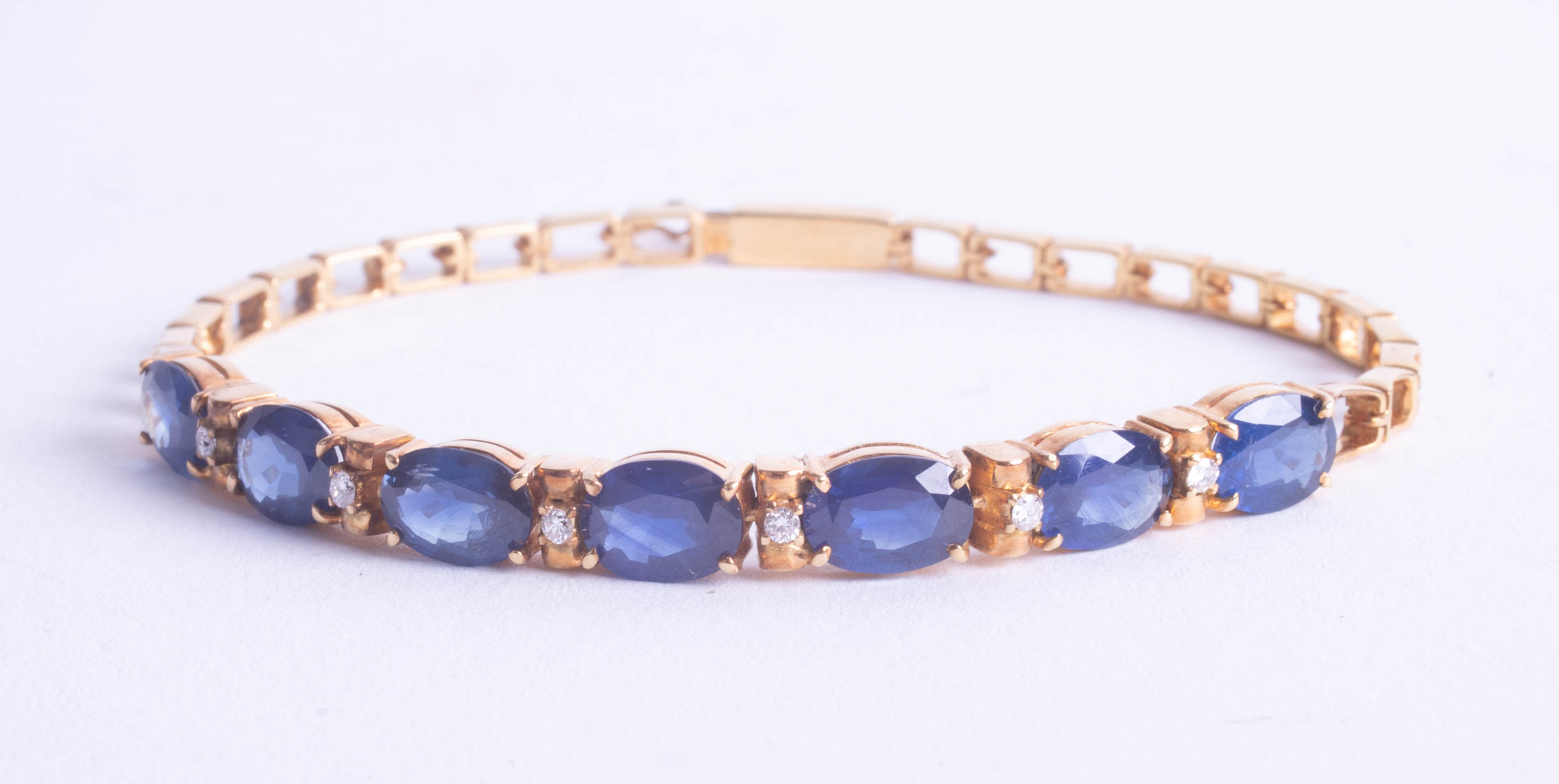Sapphire and diamond set bracelet in yellow gold together with a certificate indicating 18ct gold