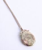A 9ct locket and chain (dent).