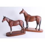 Two Beswick race horses, tallest 31cm, attached to wood plinths (2)