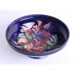 A Moorcroft blue Iris bowl, diameter 17cm signed and stamped.