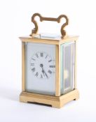 A brass cased carriage clock, with striking movement, gong, white dial with roman numerals, height