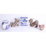 A collection of oriental ceramics including two 'dragon dogs', flower vase and ginger jar (4).