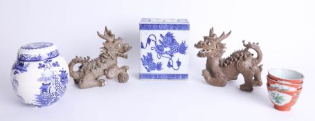 A collection of oriental ceramics including two 'dragon dogs', flower vase and ginger jar (4).