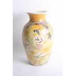 Pair of large Japanese Satsuma earthenware vases decorated with birds, gilt work and flowers on a