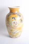 Pair of large Japanese Satsuma earthenware vases decorated with birds, gilt work and flowers on a