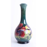 A Moorcroft green hibiscus vase, height 23cm, stamped.