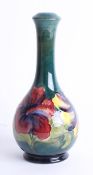 A Moorcroft green hibiscus vase, height 23cm, stamped.