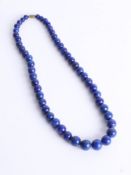 A lapis lazuli graduated bead necklace, length approx 50cm.