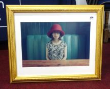 Woman in a red hat, a photographed portrait by Jojo from his 14th exhibition, Table 32 at the