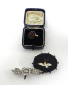 Small collection of jewellery including a 9ct gold garnet ring, silver marcasite brooch and another.