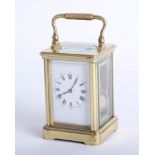 French brass case carriage clock, dial with roman and Arabic numerals, platform escapement, striking