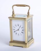 French brass case carriage clock, dial with roman and Arabic numerals, platform escapement, striking