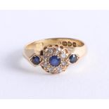 An 18ct yellow gold sapphire and diamond cluster ring, with Chester hallmark, size Q.