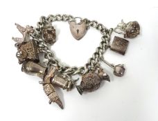 A silver charm bracelet approx 93g.