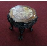 A Chinese carved rosewood and marble low table.