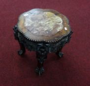 A Chinese carved rosewood and marble low table.