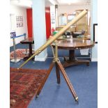 A 19th century brass, floor standing telescope marked 'Davis, London' on wooden adjustable tripod