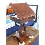 A small mahogany reading stand, the upper section with rising lid fitted with a single drawer on a