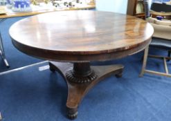 A 19th century circular, rosewood, tilt top, pedestal table, height 74cm, diameter 132cm.