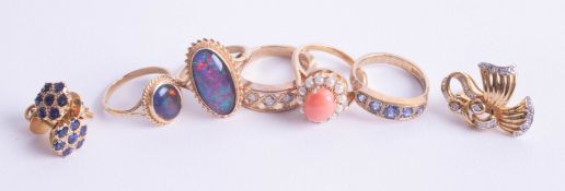 A 9ct opal set dress ring together with four other 9ct gold rings,(approximately 18.20g) a pair of