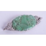 An art deco jade and diamond set brooch, boxed.