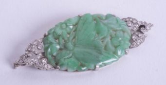 An art deco jade and diamond set brooch, boxed.