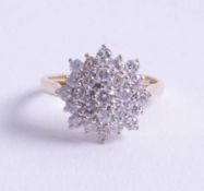 An 18ct and diamond set cluster ring, size O.