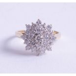 An 18ct and diamond set cluster ring, size O.