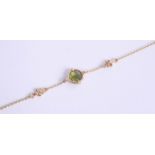 A 18ct gold bracelet set with a single peridot style stone.