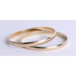 A pair of 9ct gold slave bangles, approximately 38.70g.