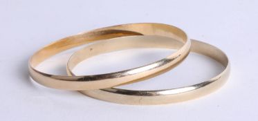 A pair of 9ct gold slave bangles, approximately 38.70g.