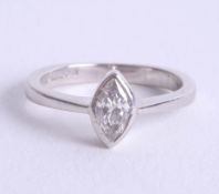 A modern platinum and diamond set solitaire ring, the diamond of marquise cut, size J/K.