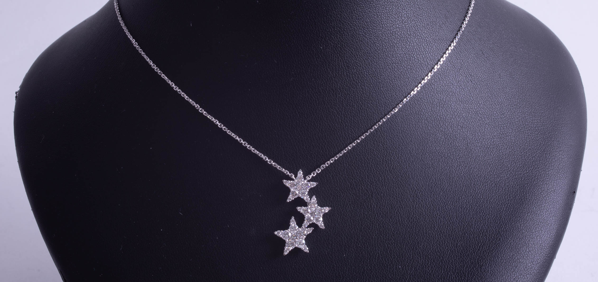 An 18ct diamond three star pendant. - Image 3 of 3